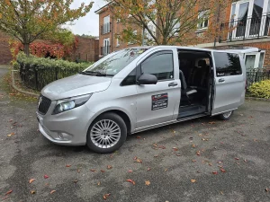 A&L cars Mercedes People carrier taxi outside someone's home