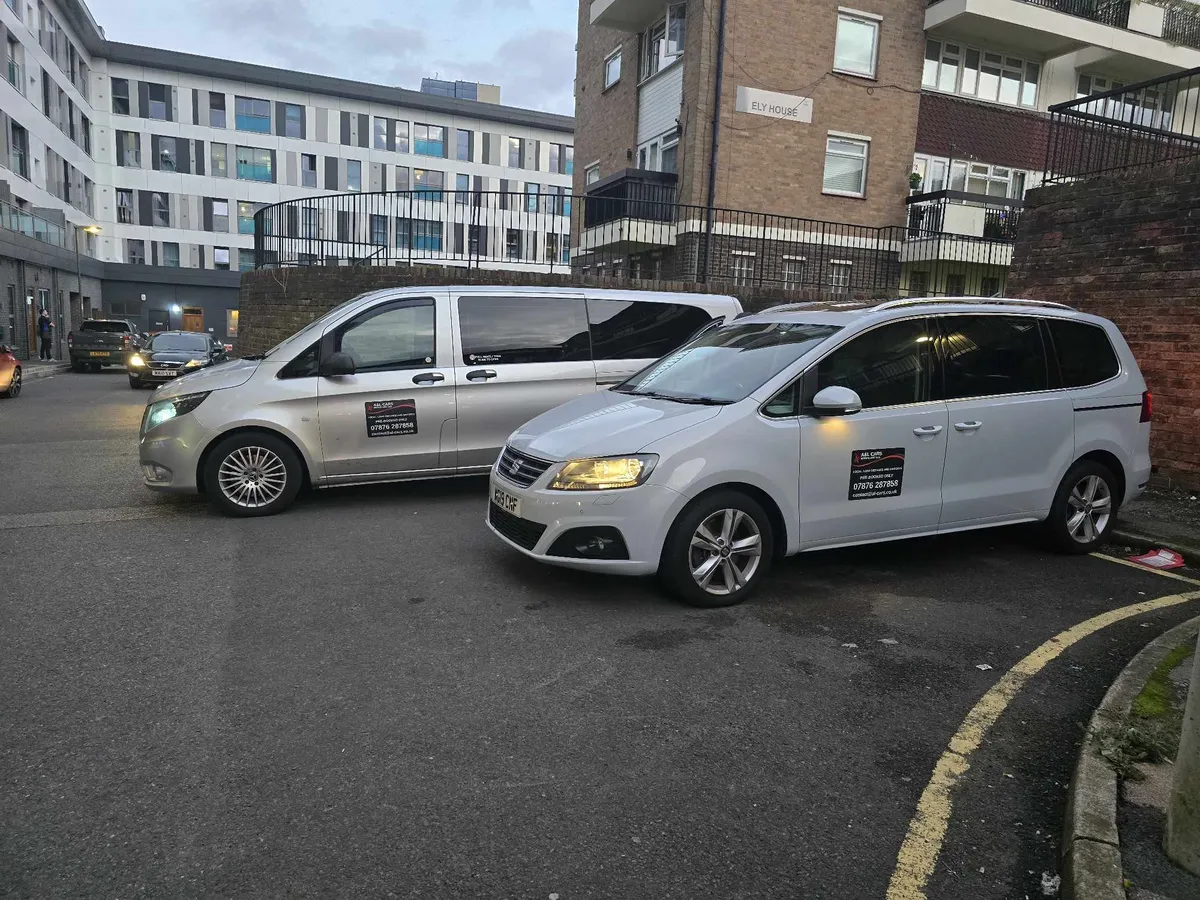 A&L cars Mercedes People carrier taxi and SUV taxi parked in a car park