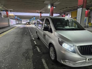 A&L Car's people carrier taxi waiting at the Gatwick pick up and drop-off area