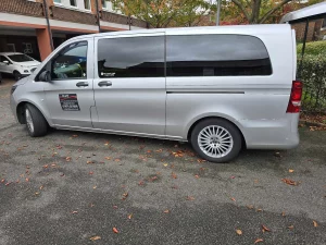 A&L Car's people carrier taxi parked outside someone's home
