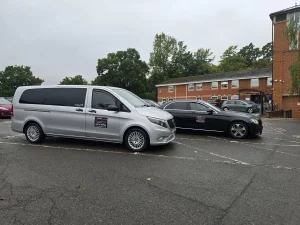 A&L cars Mercedes People carrier taxi and saloon taxi parked in a car park