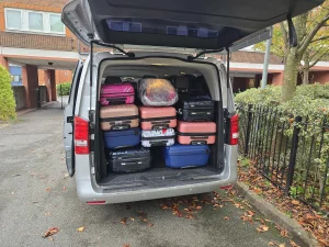 The boot of A&L Car's people carrier taxi full of suitcases