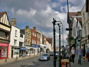 Dorking High Street showing people and cars